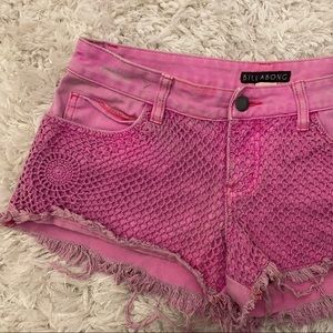 Distressed pink denim shorts